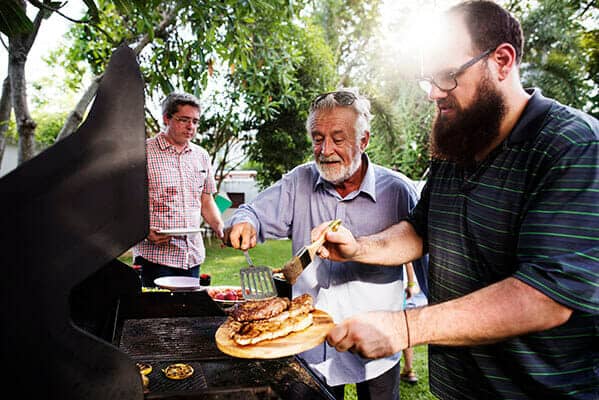 400px men helping cooking homemade steak at bakcyard sum PJW79A7 Diversity Community Care | NDIS Provider 10