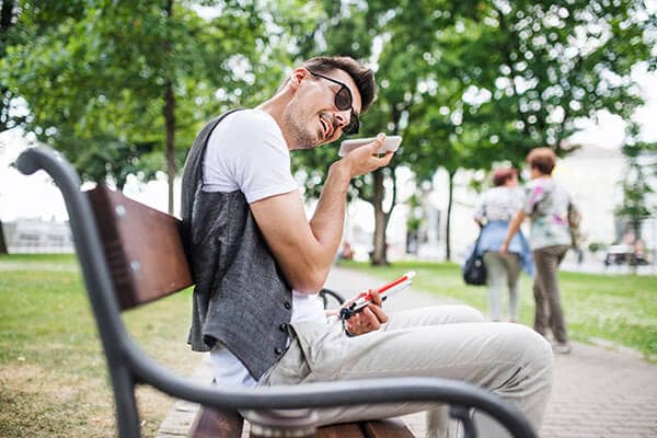 400px young blind man with smartphone sitting on bench i SW4XRMB Diversity Community Care | NDIS Provider 15